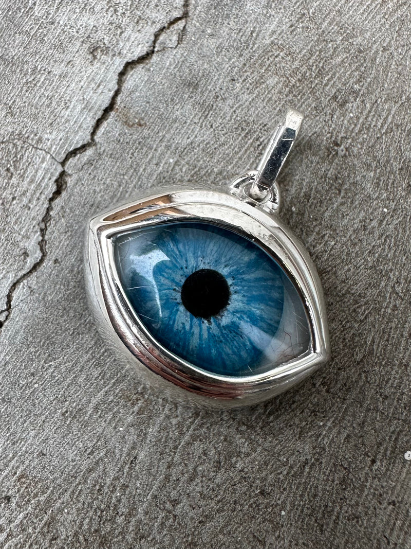 Bright blue green Silver Eye Pendant